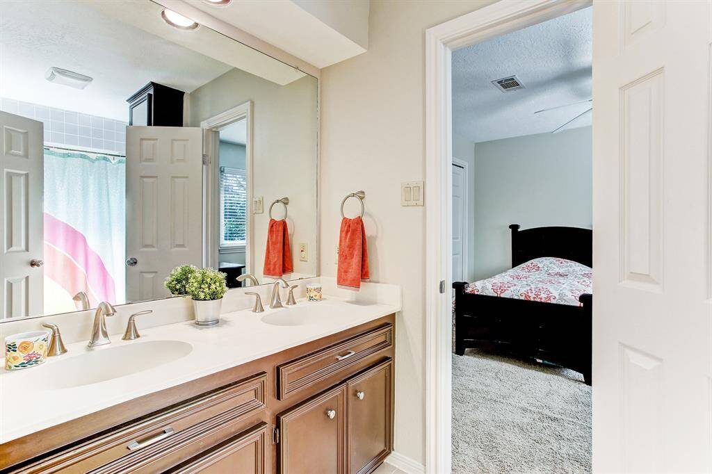 Shared bath by third and fourth bedroom.