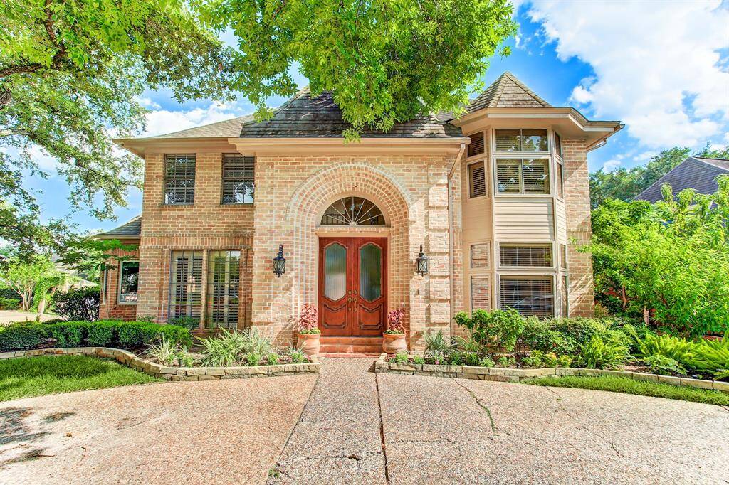 Large corner lot with round driveway and newly designed landscaping. Home has never flooded.