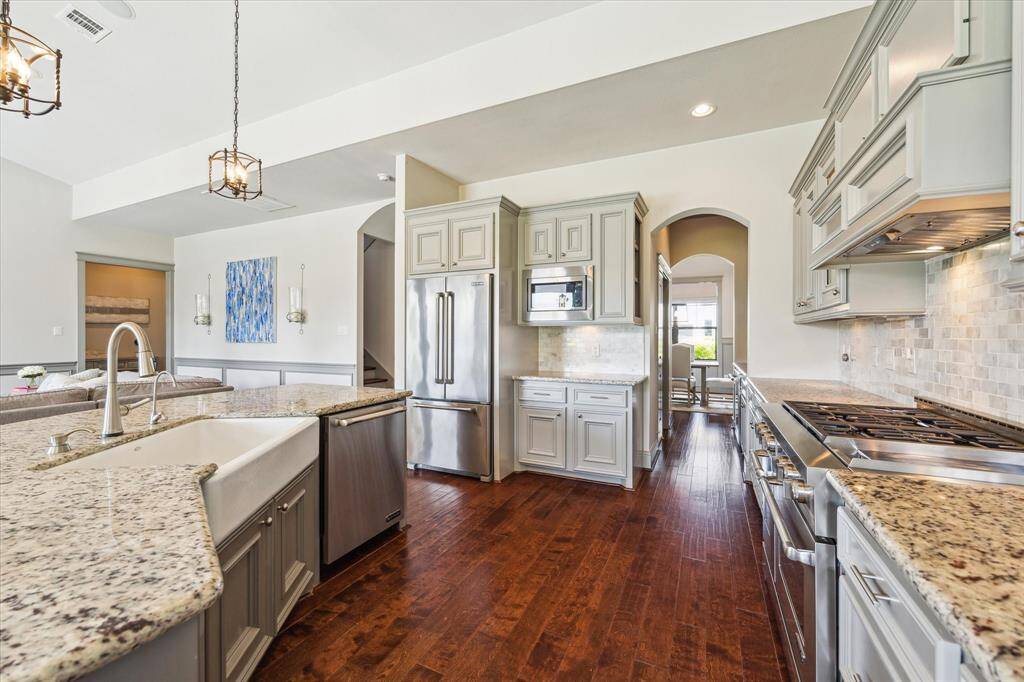 Tons of custom cabinetry, built in micowave, stainless steel Jenn-Air appliances