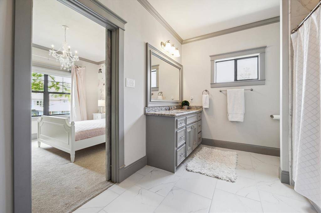 En suite bathroom boasts tub/shower combo and 2 large closets