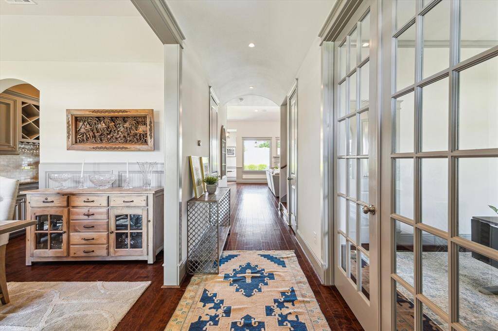 Light and bright entry leads to the home office or dining room