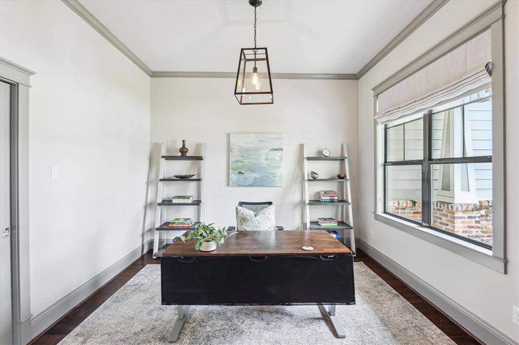 Home office overlooking the front of the property with hardwood floors, high ceilings and a large storage closet