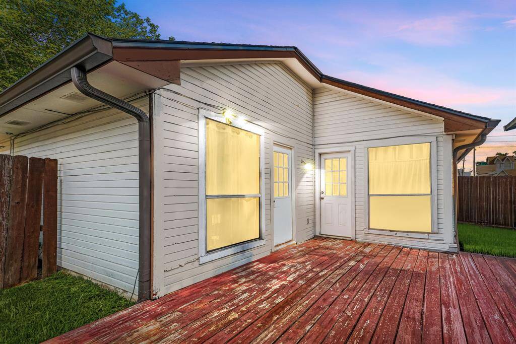 The expansive backyard deck offers ample space for lounging, entertaining, or enjoying weekend BBQs in your own private retreat.