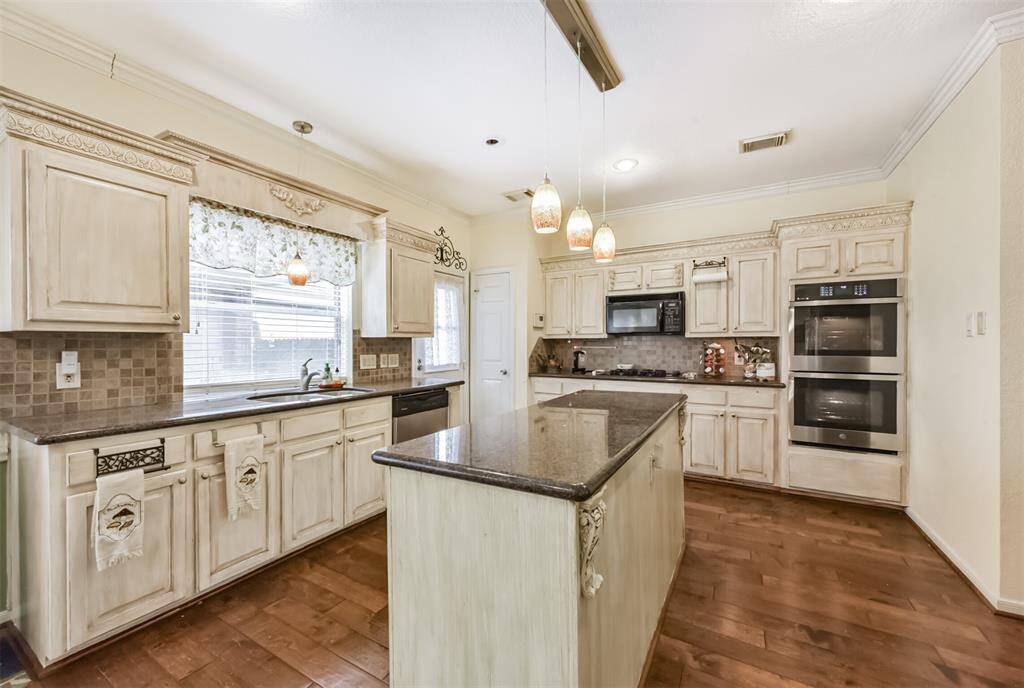 Kitchen with large island, recent double oven , lots of counter space and storage potential