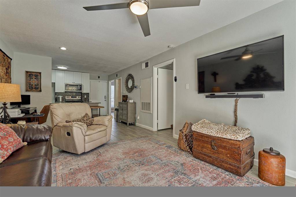 A view showing the open layout from the living room through to the dining room and kitchen.
