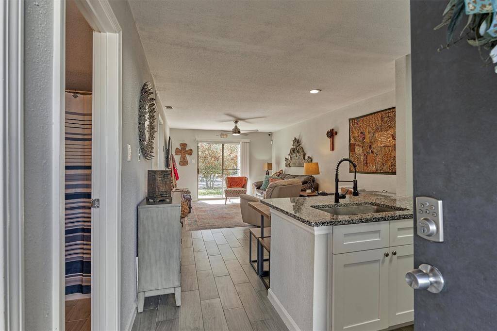 Step into modern elegance with this fully updated townhome, boasting sleek vinyl plank flooring throughout for a seamless and sophisticated feel.