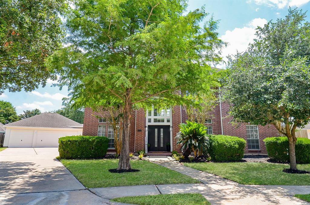 Mature trees with beauiful landscaping welcome you into your next space to call HOME