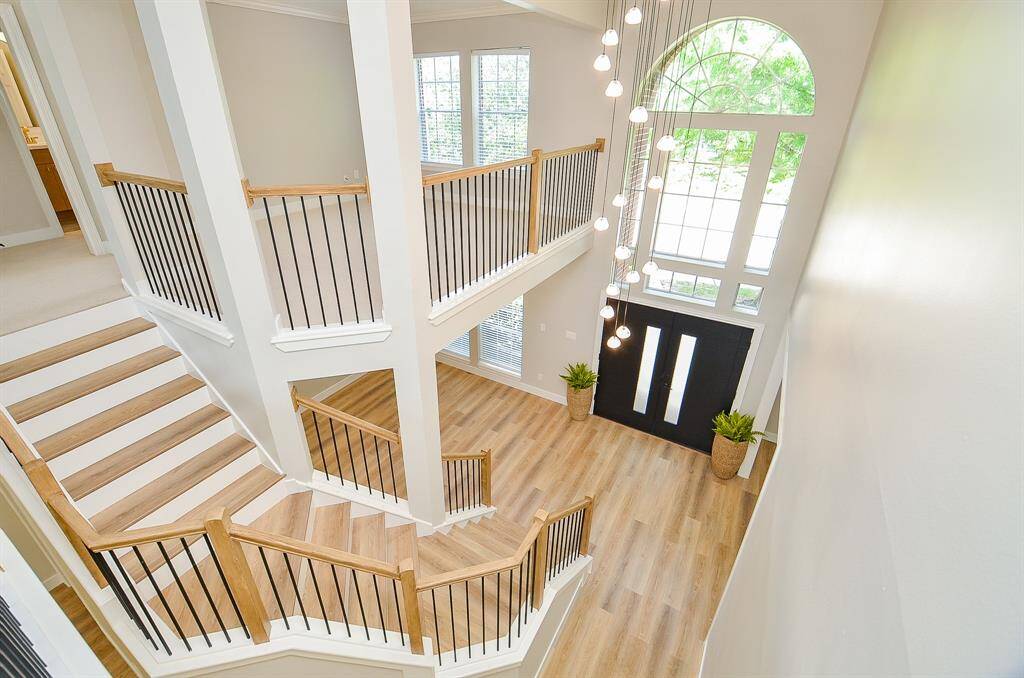 This stunning staircase beautifully blends modern design with timeless character, enhancing the home's unique charm.