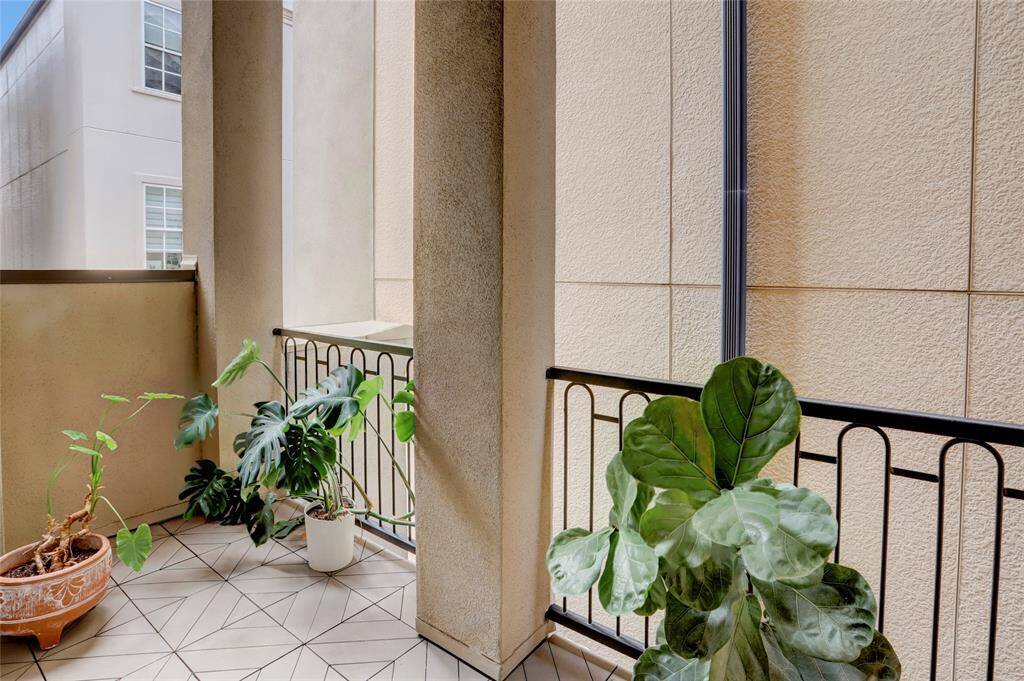 View of side balcony on 2nd floor located off the living area. Wrought iron railings. Great spot for your outdoor plants.