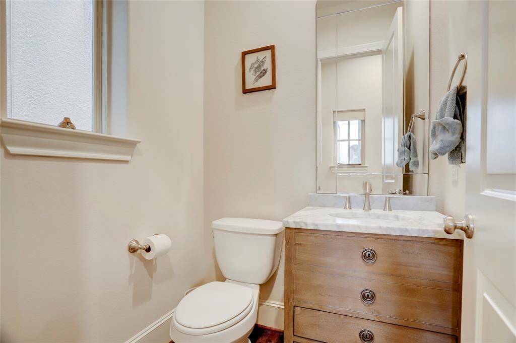 Lovely simple powder room half bath located on the 2nd floor down a hallway near the living area and dining room.