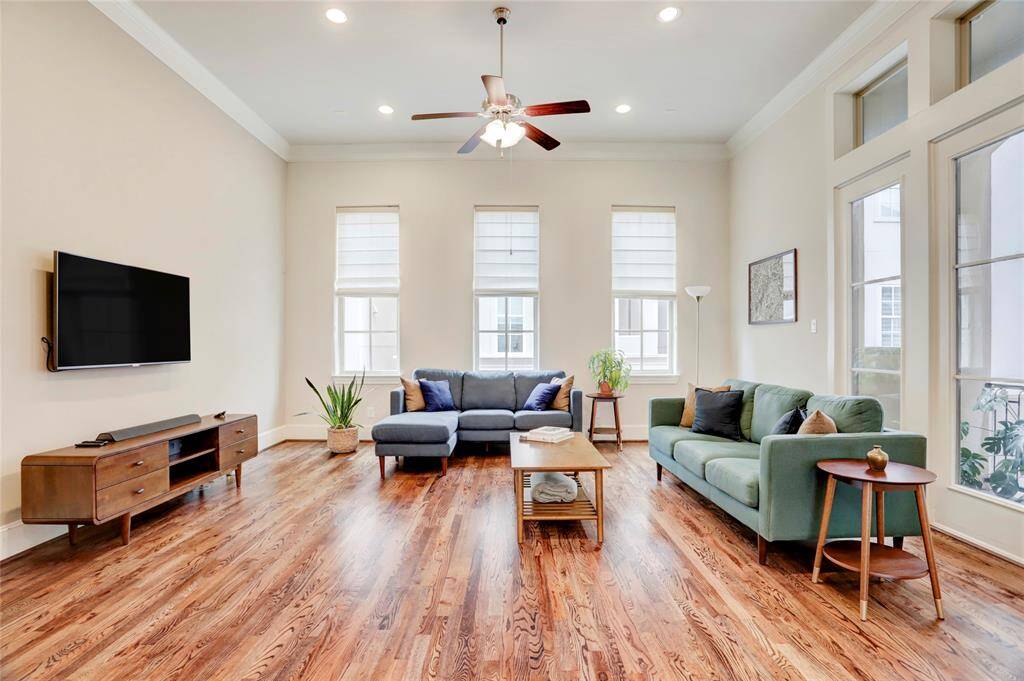 Stunning real red oak hardwood floors really elevate the space and run throughout most of this lovely home. Soaring high ceilings! Crown molding! Recessed light. Ceiling fans. Lots of double-paned windows for plenty of natural light.