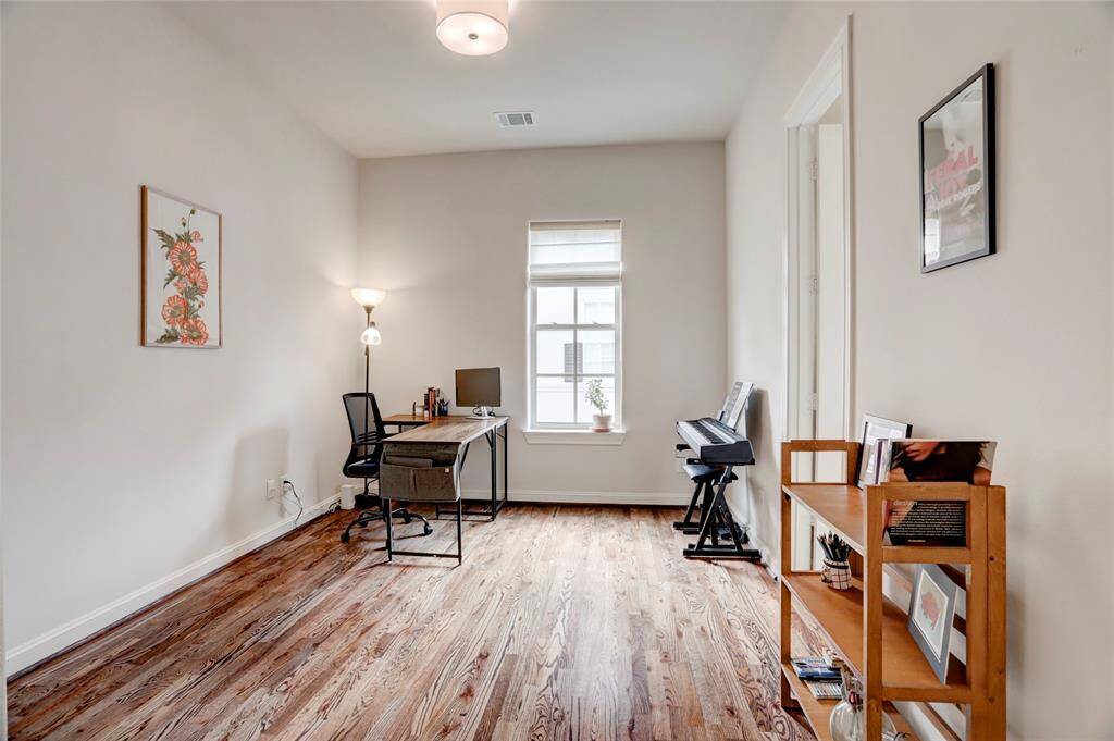 Guest bedroom on 3rd floor with ensuite bathroom and large walk-in closet. Would make the perfect home office space! The laundry room is located on the 3rd floor next to this bedroom.