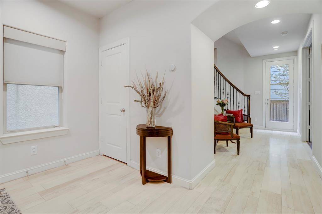 Inviting front entry foyer is light and bright! Convenient coat closet. Recessed lights. Curved arch leading to stair case. Glass back door to wonderful private back deck and back yard space!