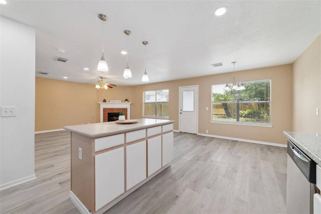 View from the Kitchen to the fireplace.
