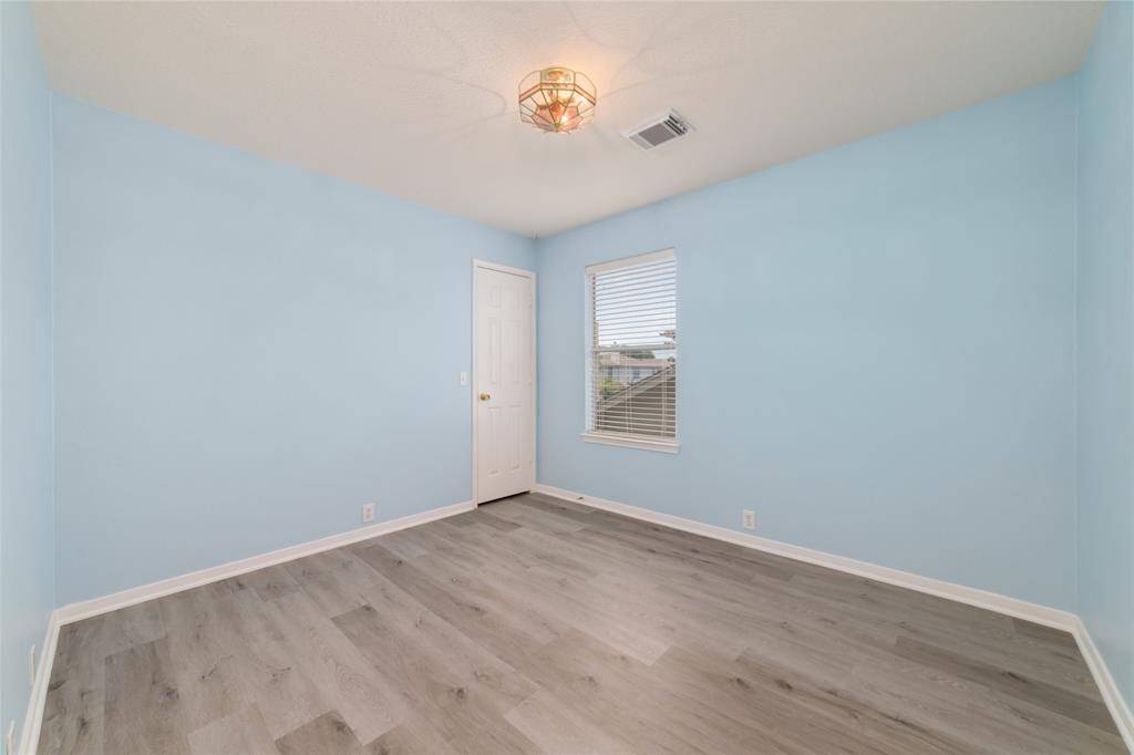 Bright room with soft blue walls.,