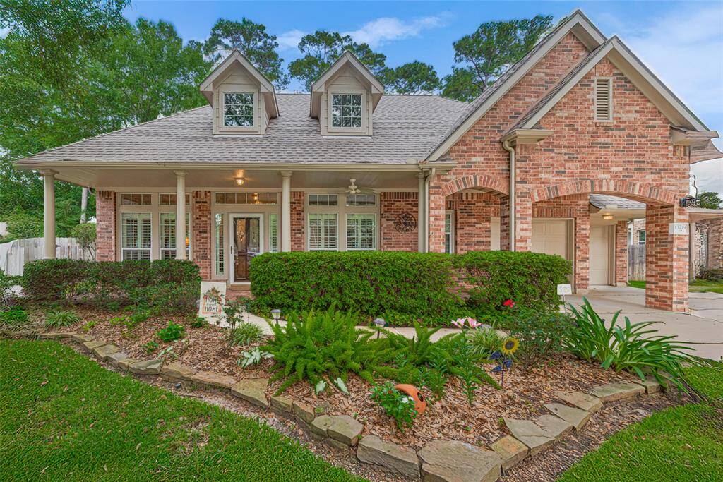 Welcome home to this meticulously maintained 1.5-story brick home. Charming columns, arches, dormers, gables, transom windows, and lush landscaping create stunning curb appeal.