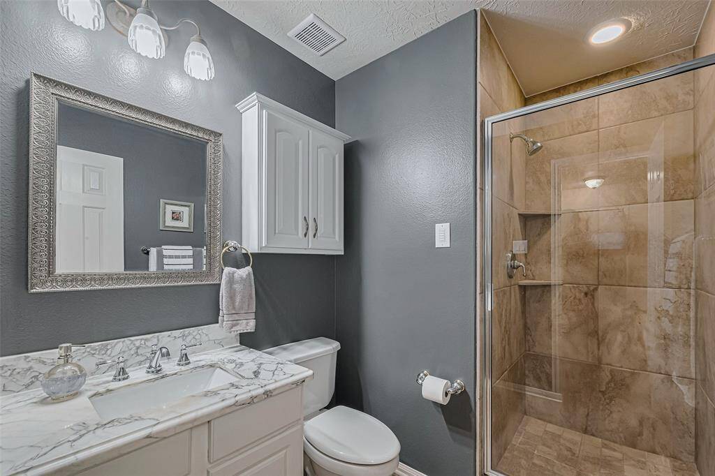 The kitchen offers ample counter space, pull-out drawers in the lower cabinets and a cozy breakfast area, making it easy for everyone to cook and gather together comfortably.
