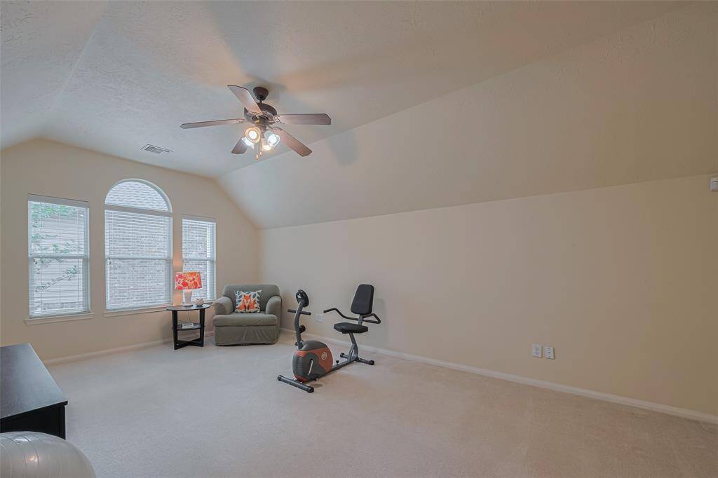 A pass-through bathroom with tub/shower combo and comfort-height toilet connects two dressing rooms. This vanity area includes a double-door linen closet.