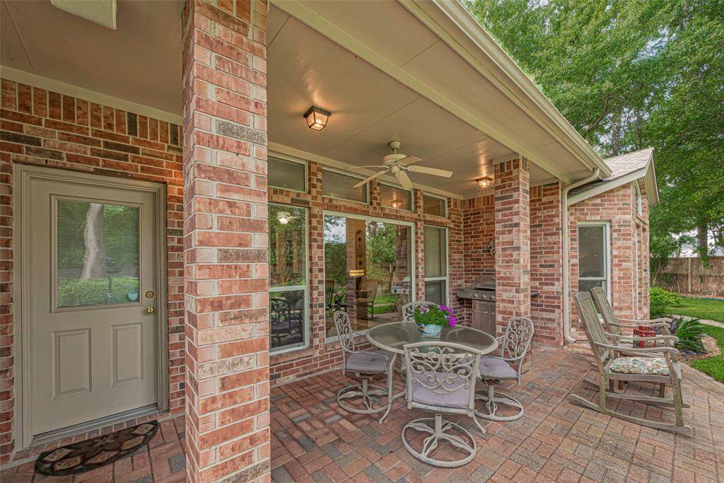 Your covered brick patio, complete with built-in speakers and a ceiling fan, offers the perfect setting for outdoor relaxation and entertaining year-round.