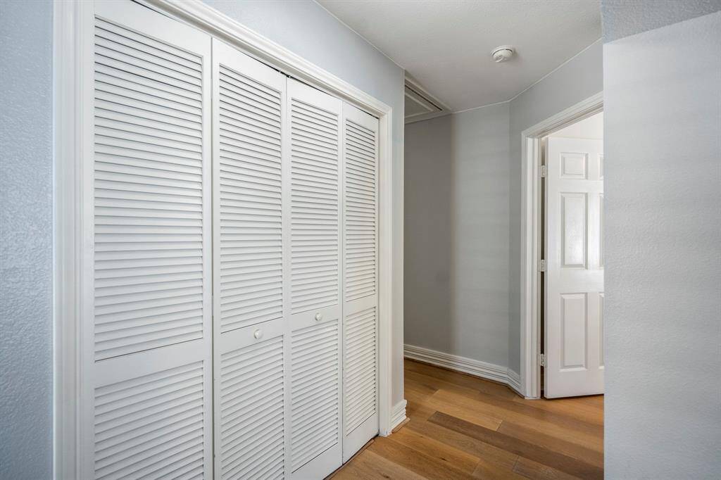 A wide upstairs hallway connects the home’s private spaces, offering both flow and functionality with great storage options & an efficiently positioned utility room.