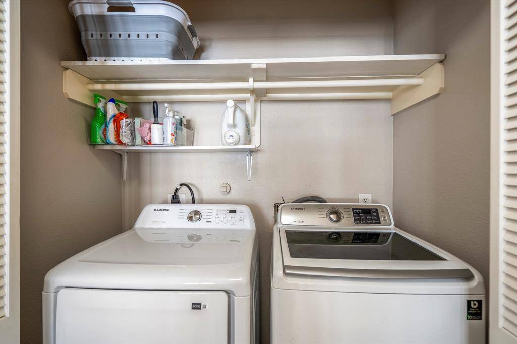 The dedicated laundry room accommodates a full-sized washer & dryer, built-in shelving, and offers just enough space to keep chores organized and out of sight, without taking up any additional unnecessary space.