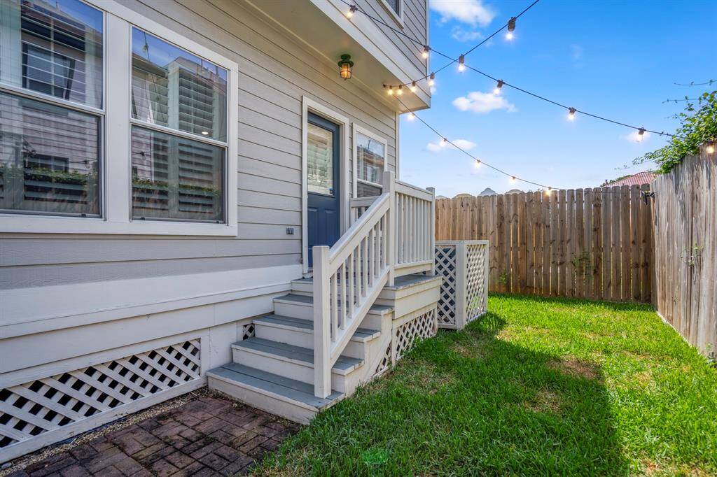 With string lights overhead and space to play or garden, this rare private backyard is your own slice of outdoor serenity, right in the heart of the Heights.