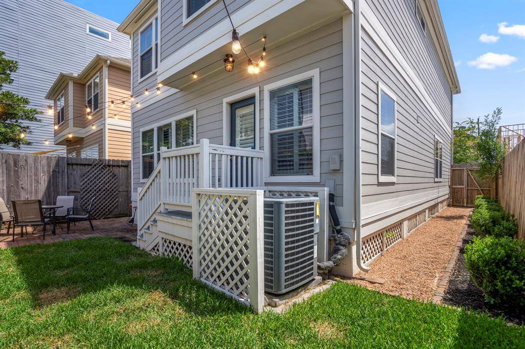 Even the side yard offers a touch of green and room to garden, creating a sense of space that’s rare in this part of town.
