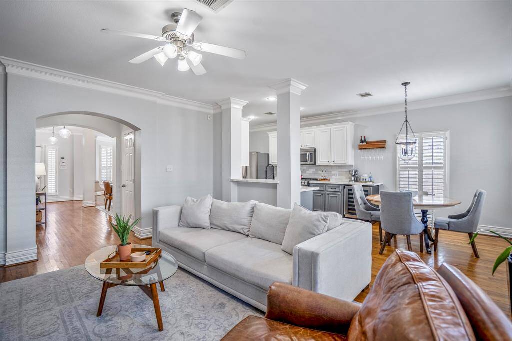 The home's open-concept layout allows the living, dining, and kitchen spaces to flow effortlessly together, creating a light-filled environment that’s ideal for connection and everyday living.