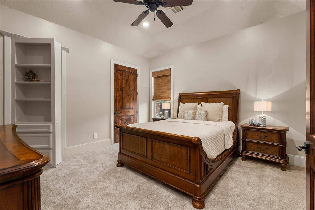 2nd bedroom downstairs is ADA wheelchair accessible including the en-suite bathroom and shower.  Don’t miss the shelves that lead to a “secret room”…