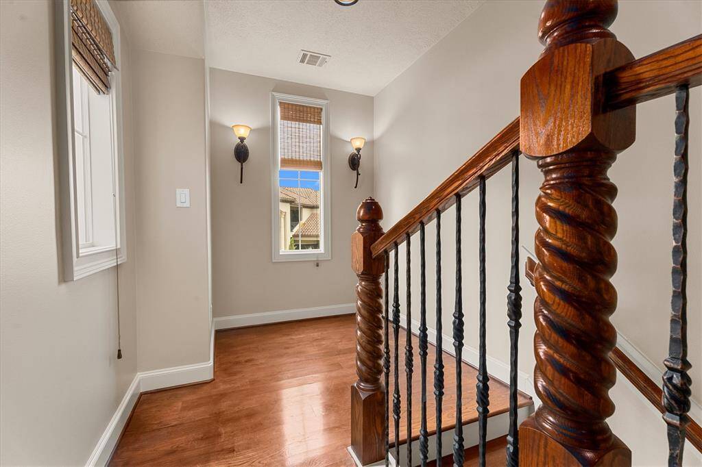 Hardwood stairs with amazing mill work lead to the second story.  This home lives like a one story with just 2 additional bedrooms upstairs.