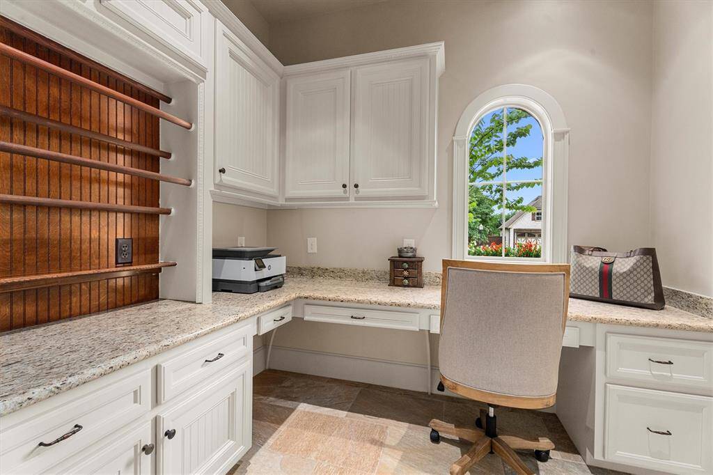 Located off of the kitchen is this 2nd home office which would be great as a hobby room. Wouldn’t you just love to have this wrapping paper station!  The attention to detail of this home is over the top!