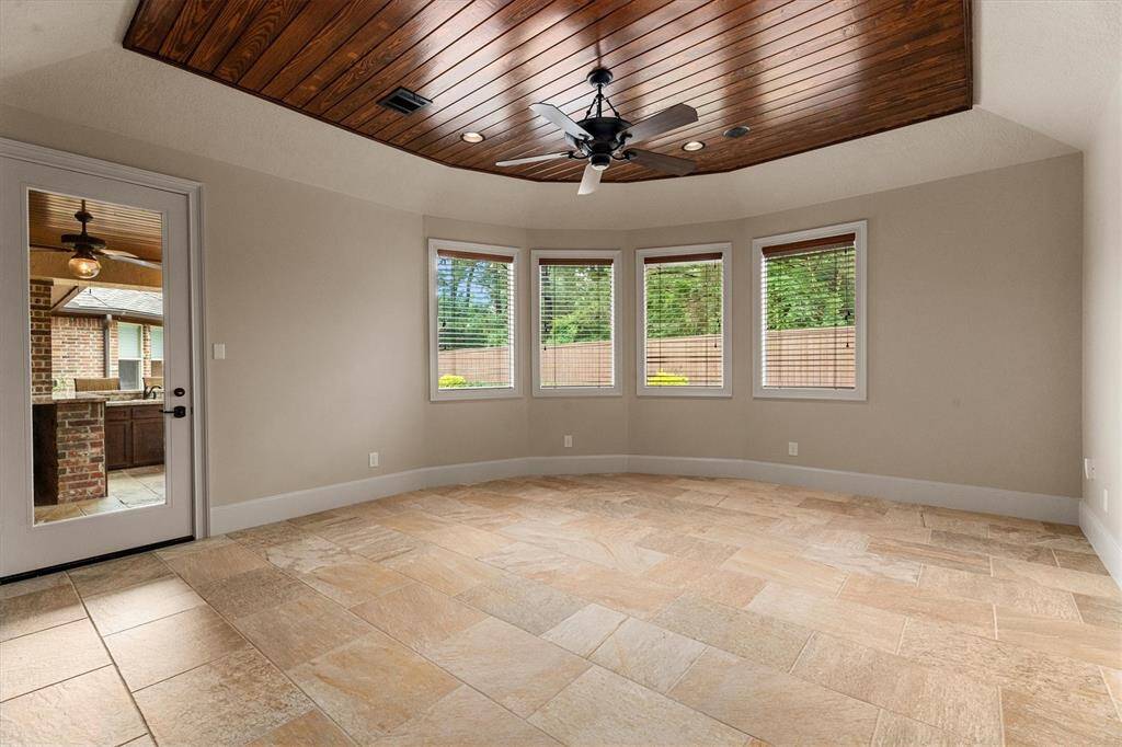 The Game Room is located on the first floor and right off of the covered patio perfect for entertaining.  This room is fully equipped with tile flooring, wood clap ceiling and ceiling fan