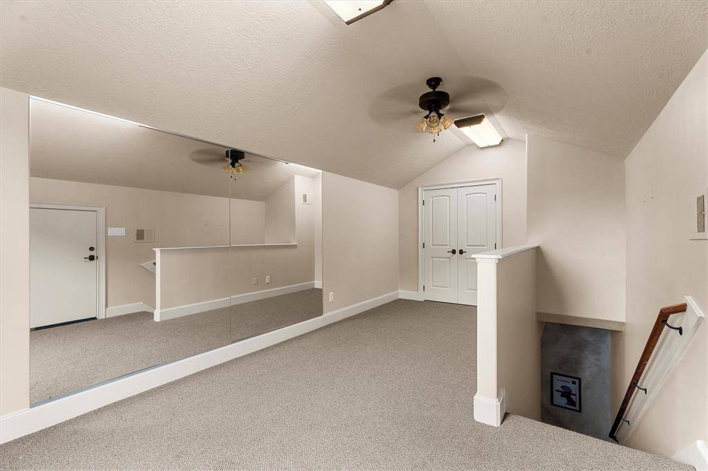 Located off of the media room, this room features built-in mirrors - excellent space for a dance studio or for exercise equipment.  With its convenient half bath, this are could easily double as quarters