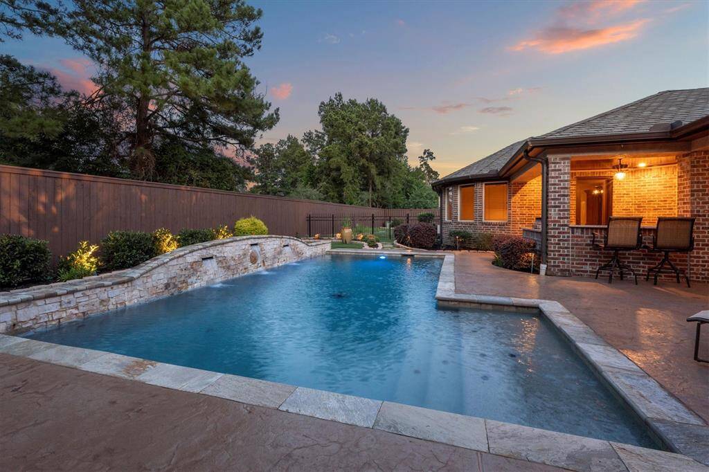Contemporary custom pool and sep. spa