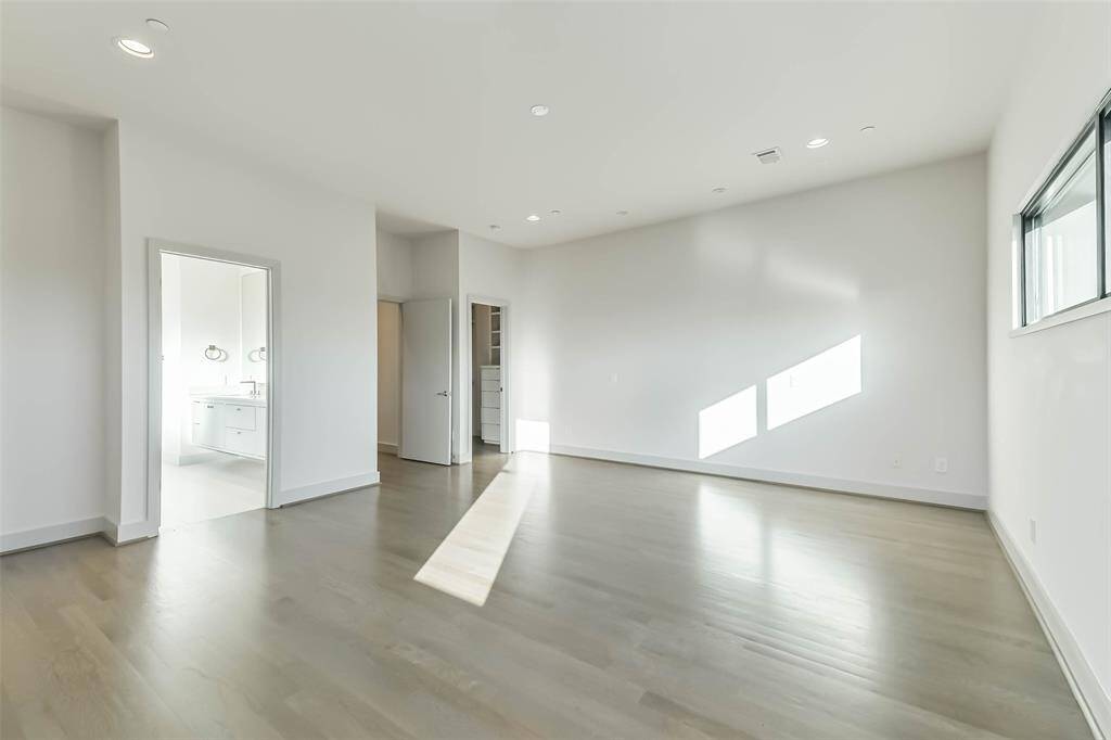 The primary suite is spacious enough for a sitting area in addition to your king sized bed and night stands. Views overlook the city, hard wood floors, access to the ensuite bathroom and 2 closets round out the features of the owner's retreat!