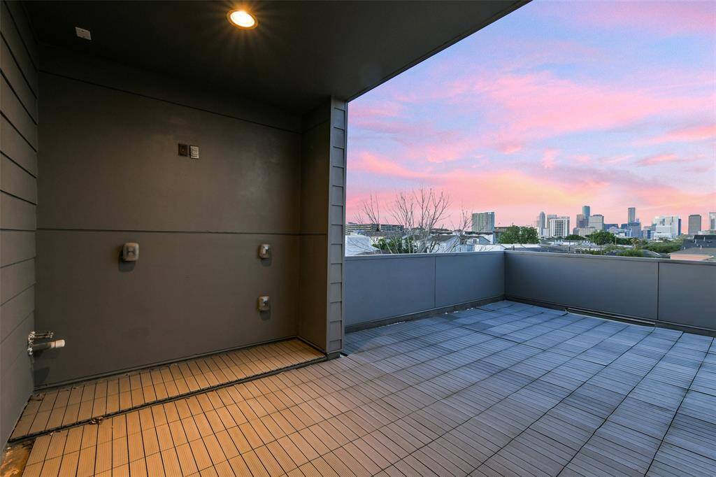 Plumbing for a sink and gas cooktop are situated under the covered area which is large enough for a table or lounge area.