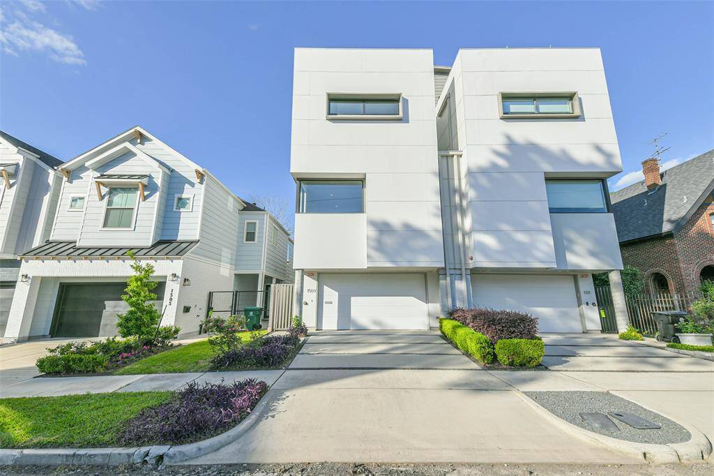 Elevation view showing the beautiful and well-maintained home and landscape.