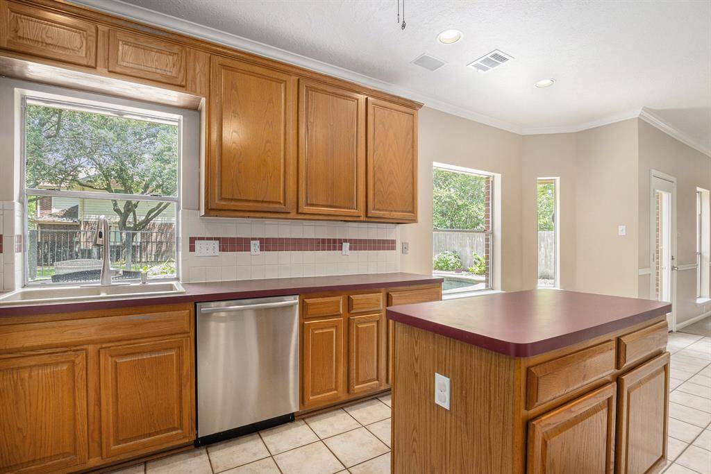 Great view from the kitchen sink! Spacious eat in nook, and lots of natural light