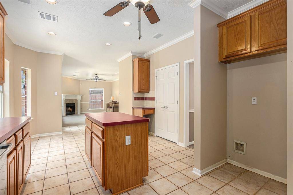 This angle shows the openness of the kitchen to the informal living area.