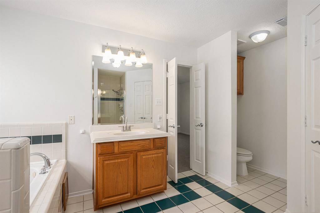 Upstairs - full primary bath - TWO closets