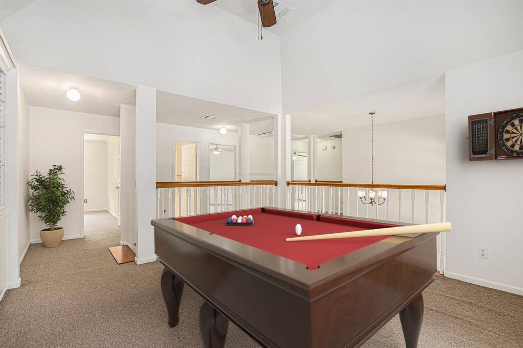 Huge upstairs flex space with a VERY large walk in closet and built in shelves. High ceiling and storage for days! Virtually staged