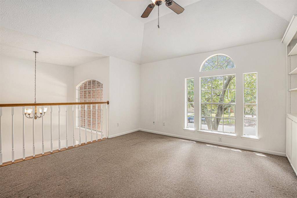 Huge upstairs flex space with a VERY large walk in closet and built in shelves. High ceiling and storage for days!