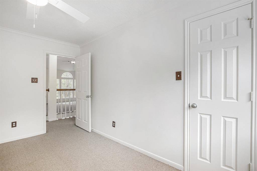 Upstairs secondary bedroom, high ceilings, and ceiling fan
