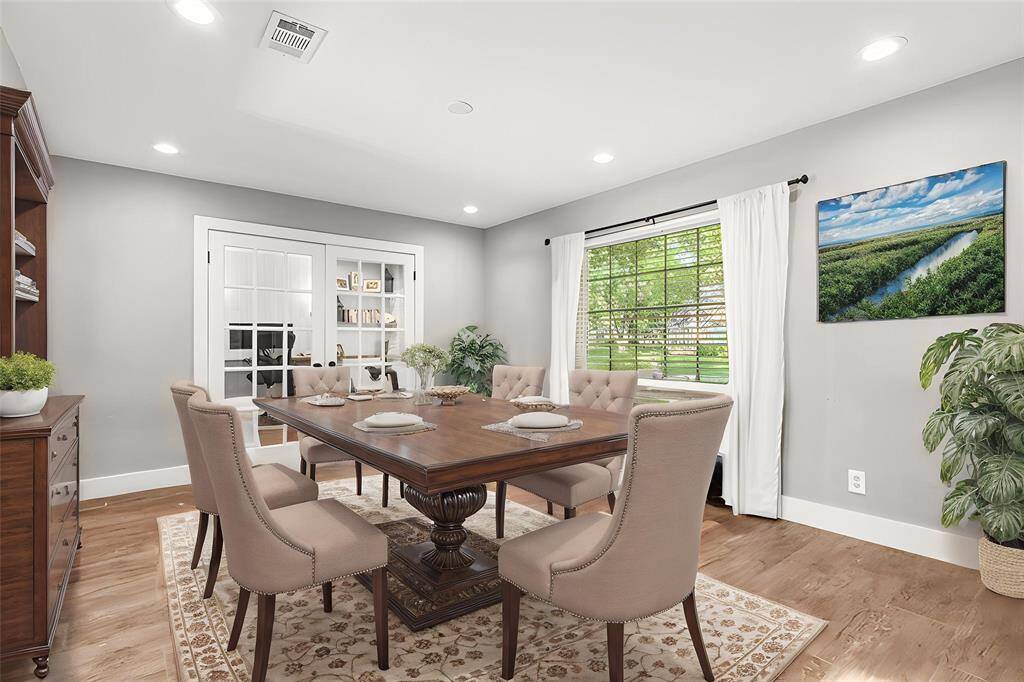 DINING ROOM- *Virtually staged* as this is currently being used as a play area. The dining room is open to the den and flex space.