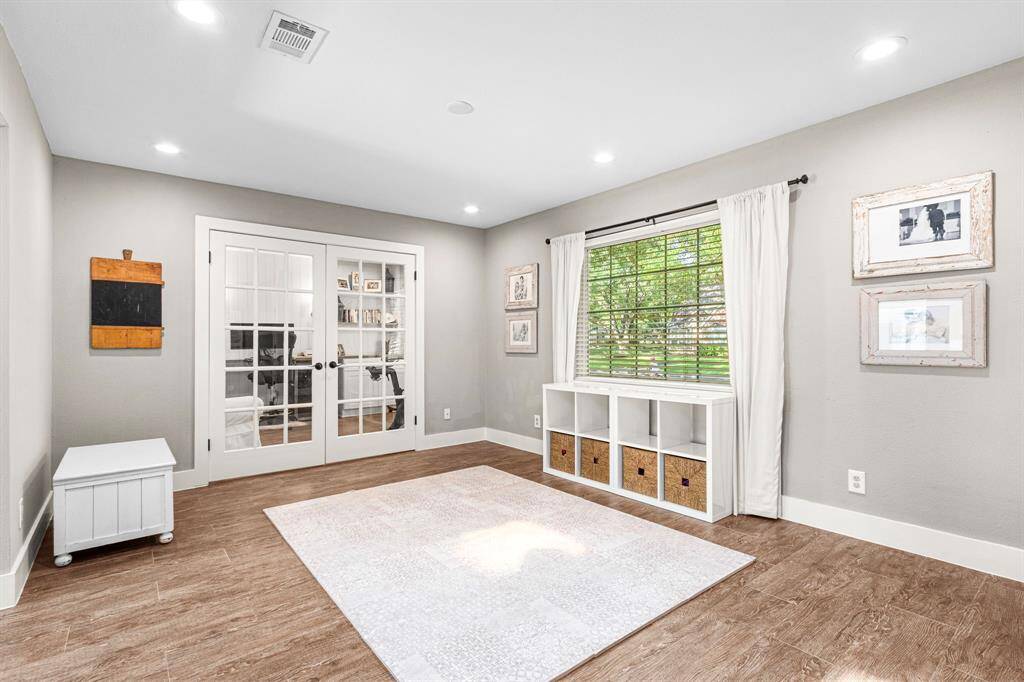 DINING ROOM- Currently being used as a play area. Open to the den and flex space.