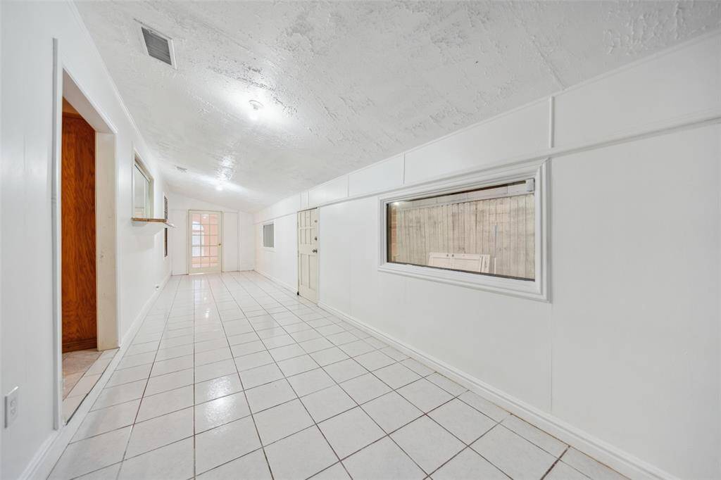 Back door accessed from this room, leads to patio and backyard