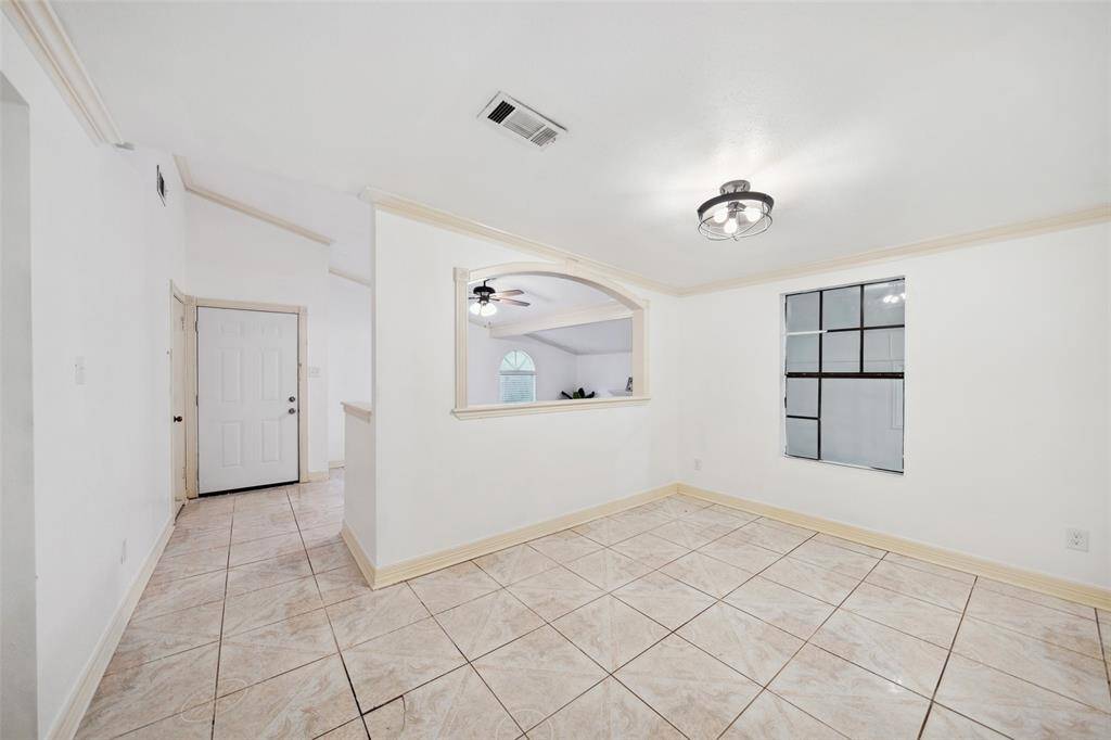 Other view of dining area. Tile throughout.