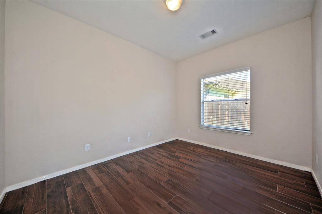 This flexible room is perfect for a home office, sitting area, or nursery. It features a large window for natural light and a walk-in closet for additional storage.
