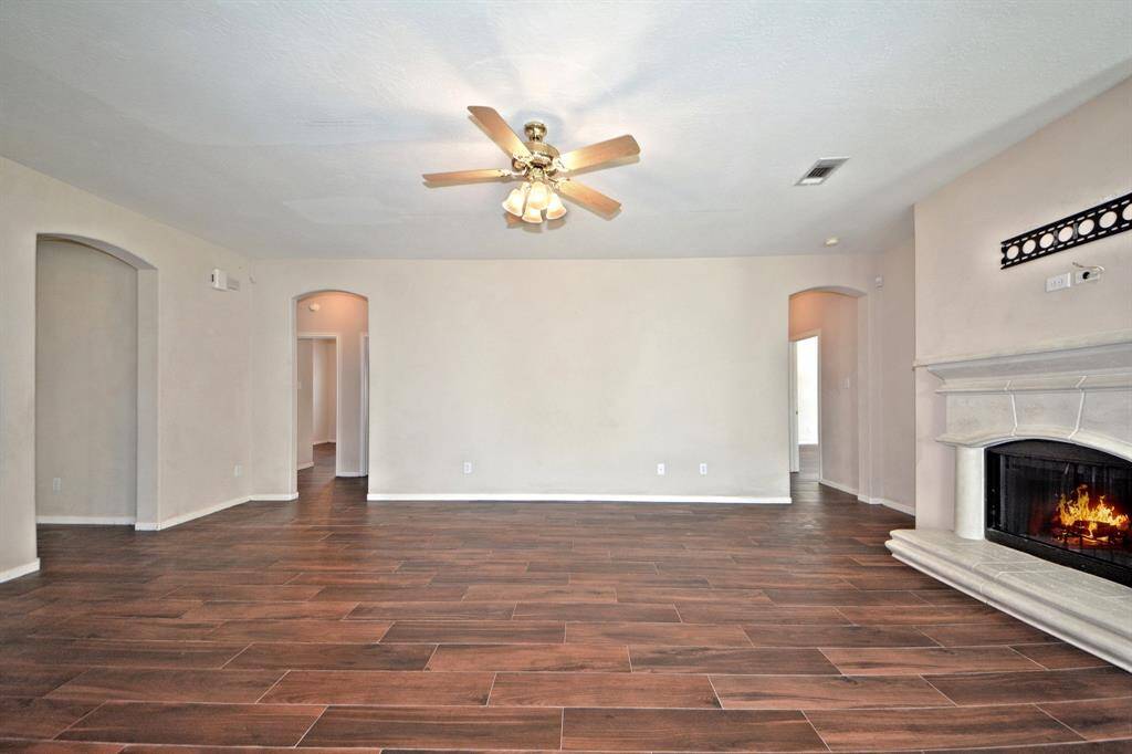 Just down the hallway, you'll find two spacious guest bedrooms and a full bathroom—perfect for family or visiting guests.