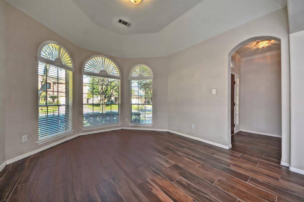 Tile wood flooring runs throughout the home, offering an elegant look with the convenience of low maintenance and durability.